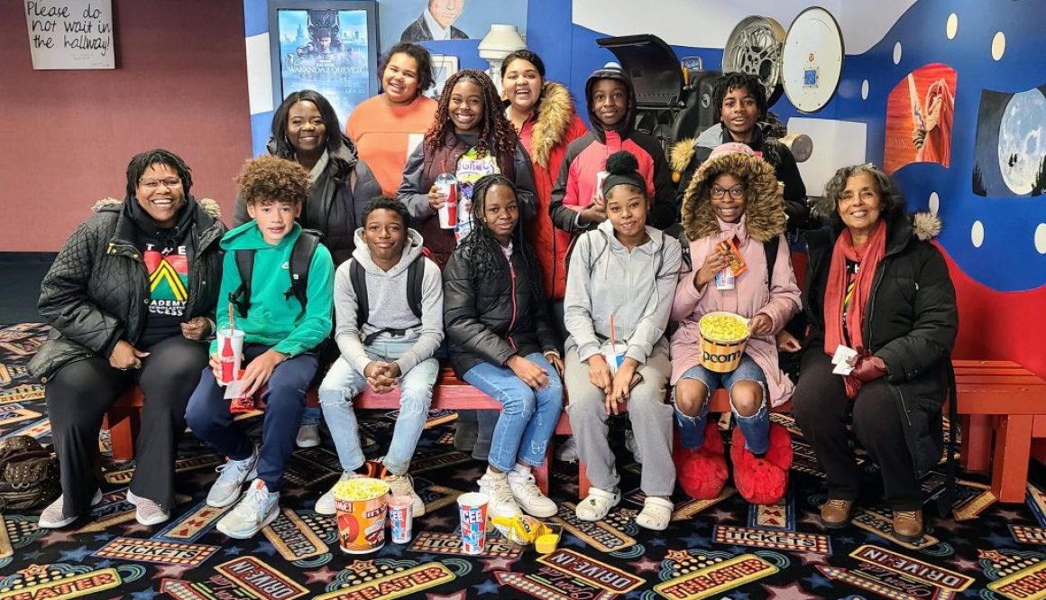 Group picture of students from Franklin Middle School before going to see Wakanda Forever, November 18, 2022 at Collins Road Theatre.