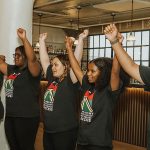 ASPS Students raising their arms during their presentation at the 2023 ASPS Gala